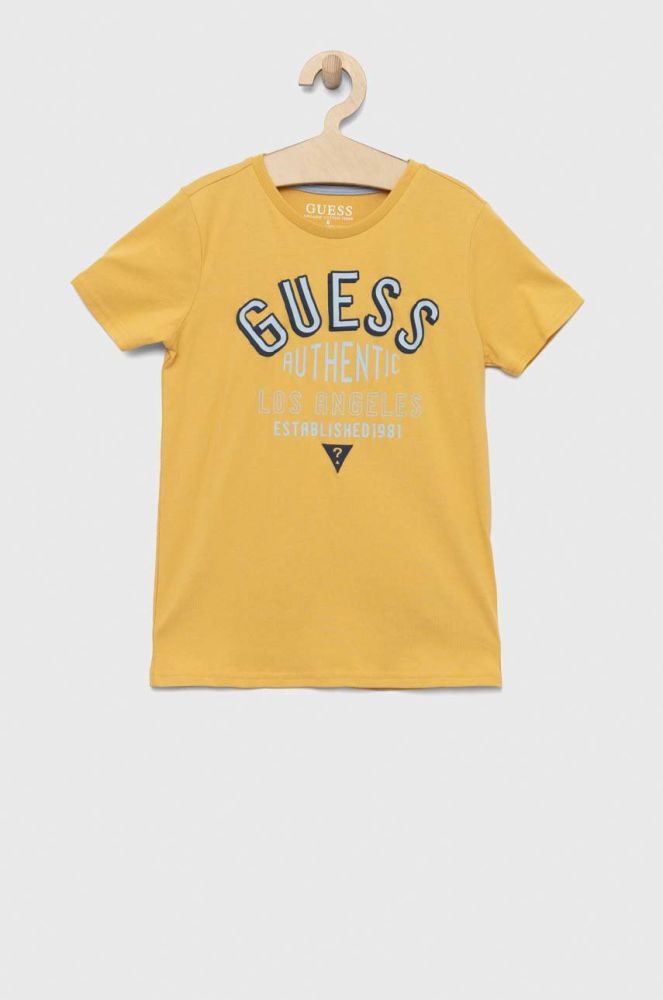 Дитяча бавовняна футболка Guess колір жовтий з принтом (2898276)